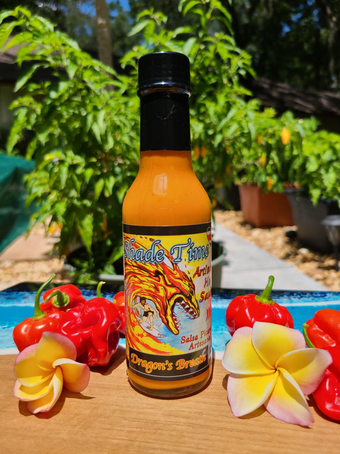 "Dragon’s Breath hot sauce bottle with extreme heat peppers"