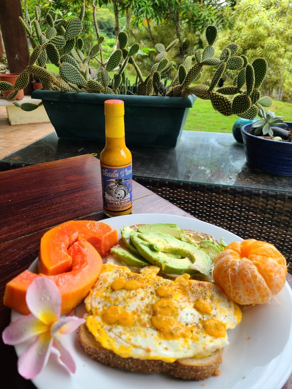 "Medium tropical hot sauce with Panameño peppers by Shade Time"