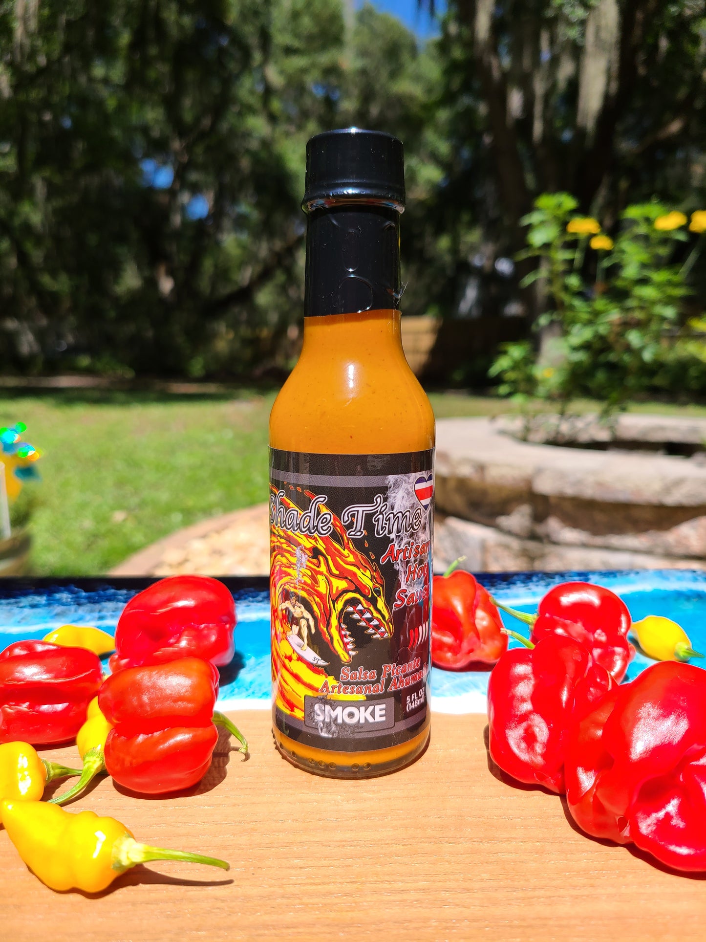 "Bottle of Smoke hot sauce with smoked Scotch Bonnet peppers"