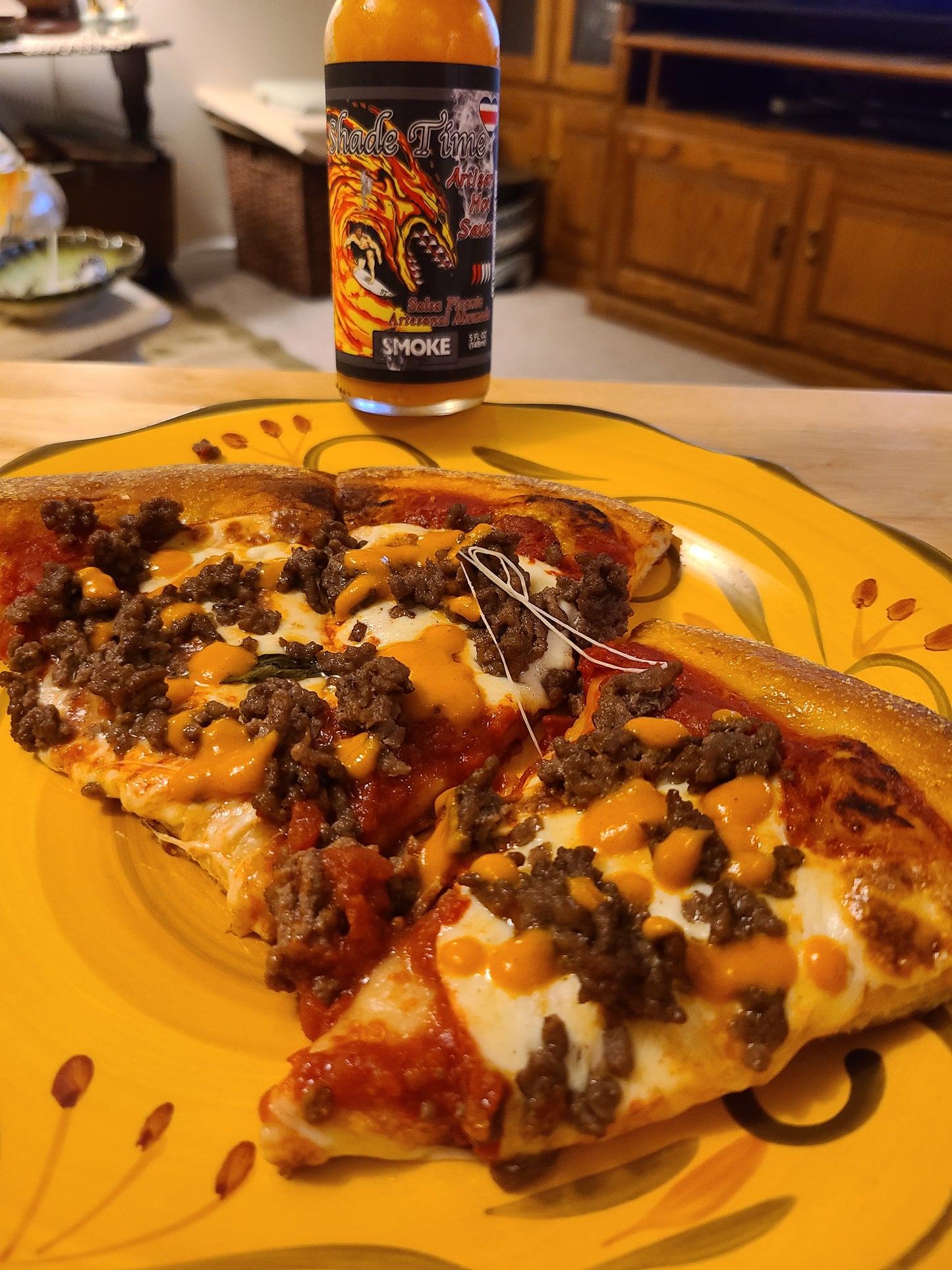 "Pizza and hot sauce"