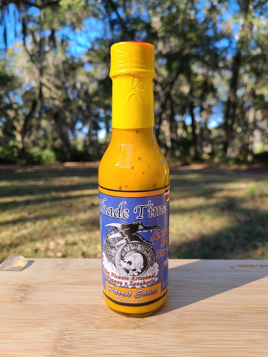 Parrot Sauce hot sauce bottle with papaya, carrot, and basil